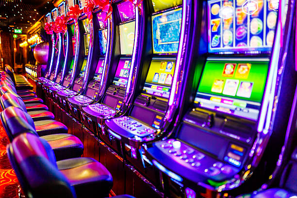 Line of electronic slot machines in casino. Property released.